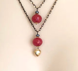 RED JADE IN BLACK CHAIN NECKLACE